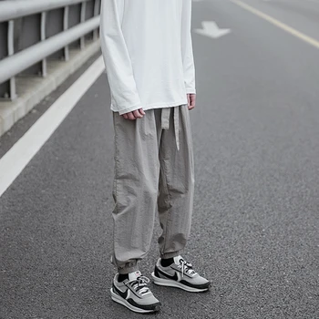 Laisvas sporto kelnės jaunimo laisvalaikio elastinga vyrų kojų Capris Japonijos ir Honkongo stiliaus atsitiktinis kelnės vasaros darbo drabužiai